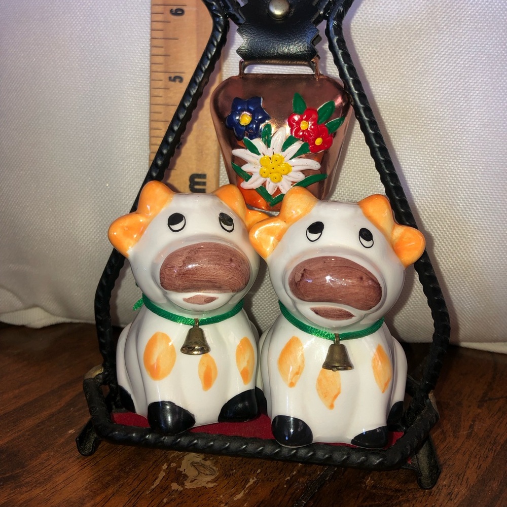Irish cow salt and pepper shakers with wrought iron stand.